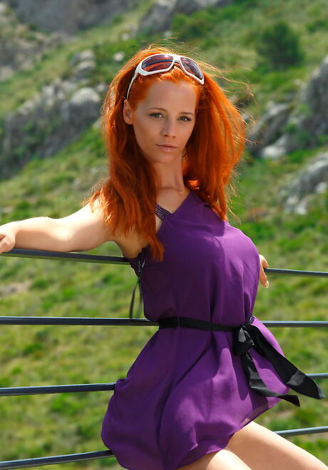 Enchanting red-haired milf Ariel Piper Fawn in skirt bares big knockers and spreads her legs outdoor