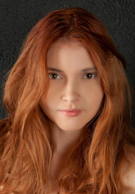 Slim redhead teen Orabelle A in sexy stockings likes some hot foot fetish 